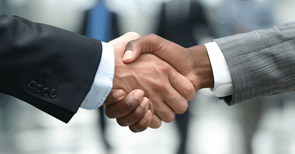 Close-up handshake symbolizing trusted IT outsourcing partnership with Mexico.