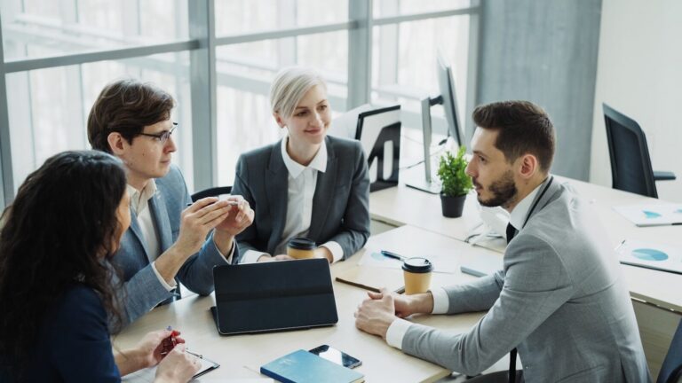 Diverse business team collaborating in a modern office.