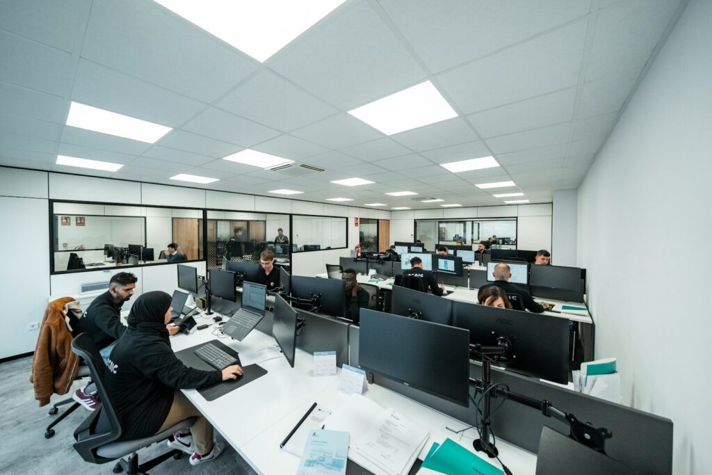 Office workers are busy working on computers.